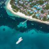 Aerial photography of a ship leaving its port with the [urpose of going and finding new adventures