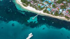 Aerial photography of a ship leaving its port with the [urpose of going and finding new adventures